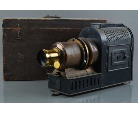 A Helios Magic Lantern, with electric illuminant, rack & pinion focusing brass lens, G, no chimney, in wooden case