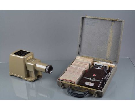 A Kodak Kodaslide Stereo Viewer II, with an array of home shot 3D slides and a Kodak Kodaslide home projector, both untested