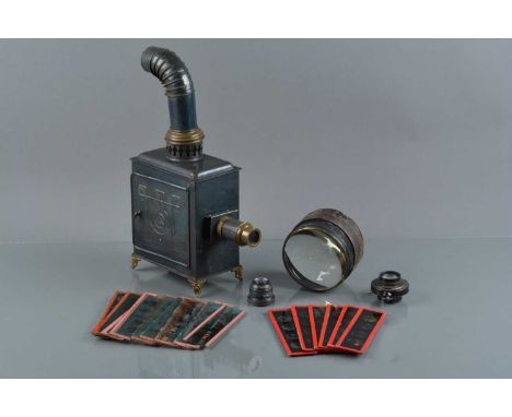 A Tin Plate toy Magic Lantern, with a array of toy lantern slides