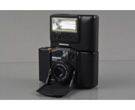 A Minox 35 GT Compact Camera, shutter working, meter responsive, self timer working, body G-VG, elements G-VG, with Minox FC 