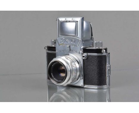An Ihagee Exa SLR Camera, type 4, 1956-59, shutter working, body G, light brassing bellow Exa logo on front plate, with Carl 