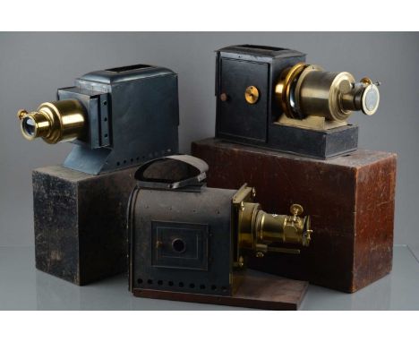 Three Magic Lanterns, all with rack & pinion focusing brass lenses, G,  two missing chimneys, one with electric illuminant, A
