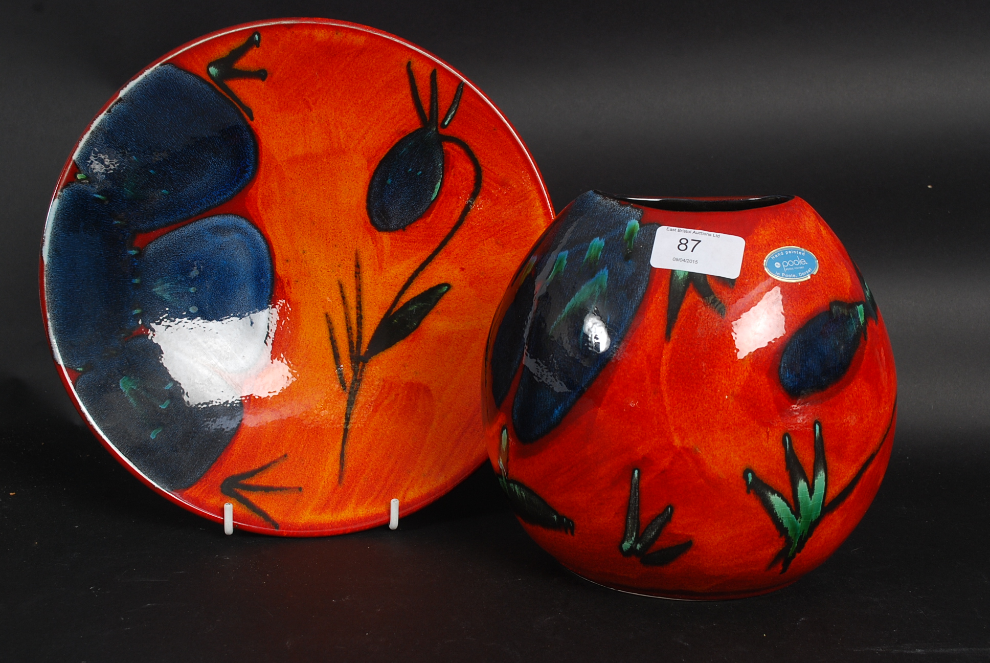 A Poole Pottery Himalayan poppy purse vase together with a Himalayan poppy plate / charger