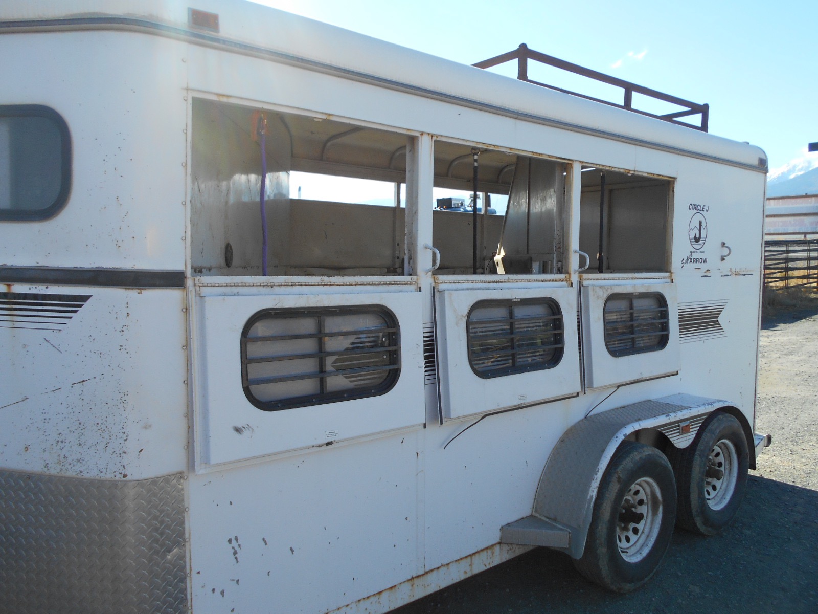 1996 3 horse slant Circle J bumper pull trailer.
