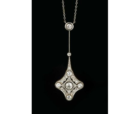 A diamond pendant necklace, the lozenge-shaped pendant drop of pierced and millegrained design, highlighted with five round b