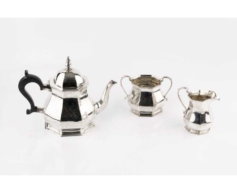 A silver three piece tea service, of octagonal baluster form, the teapot with ebonised handle, by Roberts &amp; Belk, Sheffie