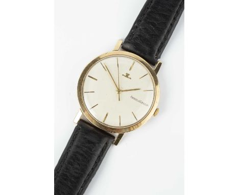 A gentleman's 9ct gold wristwatch by Jaeger-LeCoultre, the circular silvered dial with gilt baton markers and centre seconds 