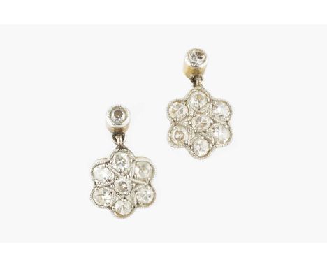 A pair of diamond cluster ear pendants, each designed as a flowerhead cluster drop of single-cut diamonds in millegrain setti