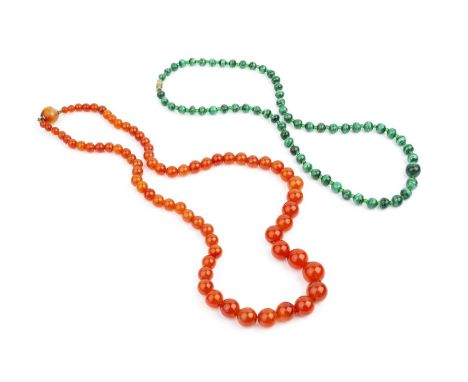 A collection of jewellery and costume items, comprising a malachite single strand bead necklace, a cornelian single strand be