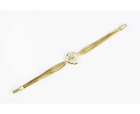 A lady's bracelet watch by Tissot, the circular silvered dial with baton markers, to a jewelled manual wind movement and tape