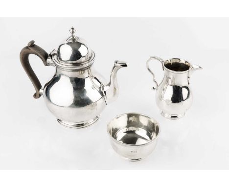 A silver three piece tea service, of baluster form, the teapot with domed cover and composition handle, by C.S. Harris &amp; 