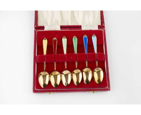 A set of six silver gilt and enamel coffee spoons, with vari-coloured enamel handles, by Adie Bros Ltd, Birmingham 1959, case