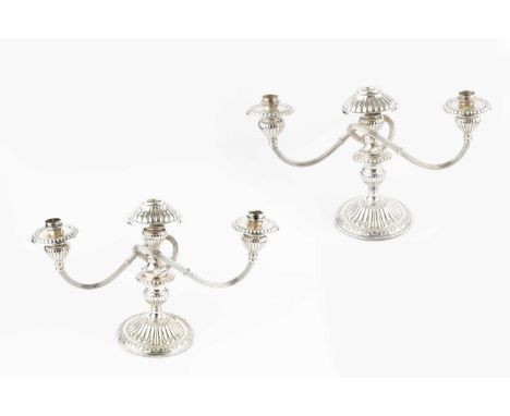 A pair of Peruvian silver three light candelabra, with detachable reeded branches, and lobed sconces and bases, stamped 'Indu