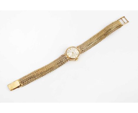 A lady's 9ct gold bracelet watch by Jaeger-LeCoultre, the circular silvered dial with gilt baton markers, to a jewelled manua