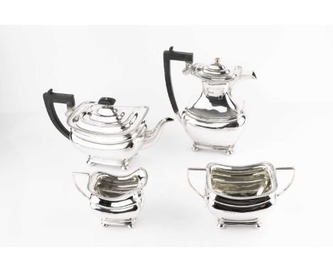 A silver four piece tea service with gadrooned borders, on bun feet, by Alexander Clark &amp; Co Ltd, Birmingham 1921, the ho