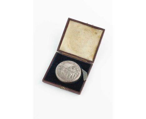 An 18th/19th century silver circular box, relief decorated to both sides with figures and inscriptions, containing a conjoine