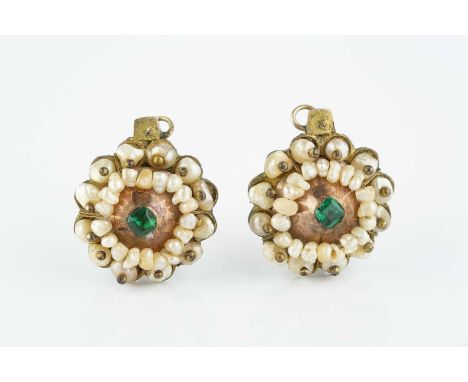 A pair of 19th century Indian pearl and stone set earrings, each circular panel centred with a cushion-shaped green stone in 