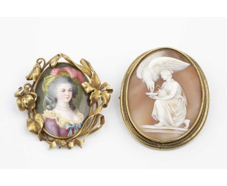 Two 19th century panel brooches, comprising an oval portrait miniature brooch, the oval panel painted to depict the profile o