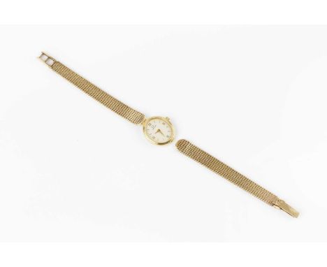 A lady's 9ct gold bracelet watch by Omega, the oval dial with gilt Roman numeral quarters and baton markers, to a quartz move