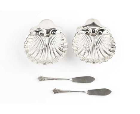 A pair of late Victorian silver butter shells, on bun feet, and with matching butter knives, by George Maudsley Jackson, Lond