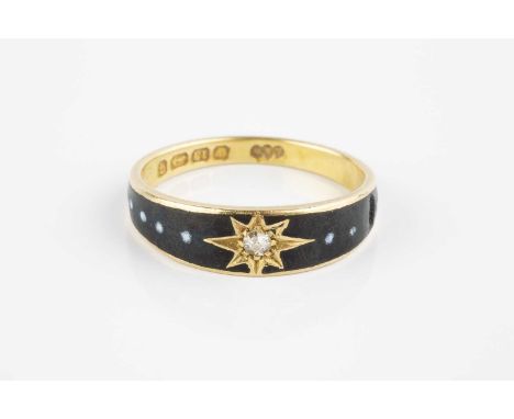 A late Victorian diamond and enamel memorial ring, the tapered black enamel hoop with beaded white enamel accents, centred wi