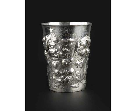 A German silver large beaker, of tapered form with slightly flared rim, embossed with flowers and scrolling foliage, the base