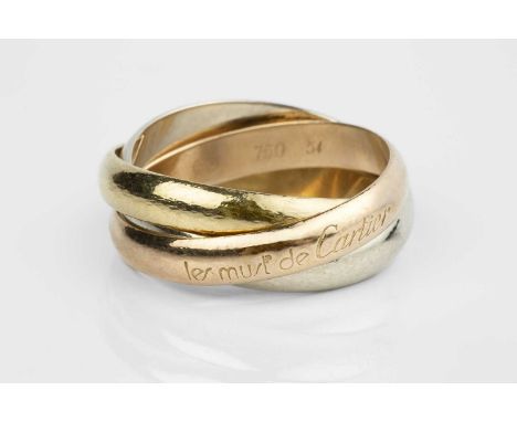 A 'Trinity' ring by Les Must de Cartier, designed as three entwined rose, white and yellow bands, signed and stamped '750', n