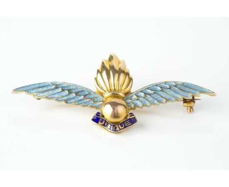 An enamel regimental panel brooch, for the Royal Artillery, modelled as a grenade above the motto 'Ubique', between blue enam