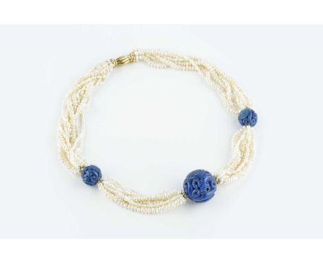 A freshwater pearl torsade and lapis lazuli bead necklace, the freshwater pearl torsade spaced by a trio of lapis lazuli bead