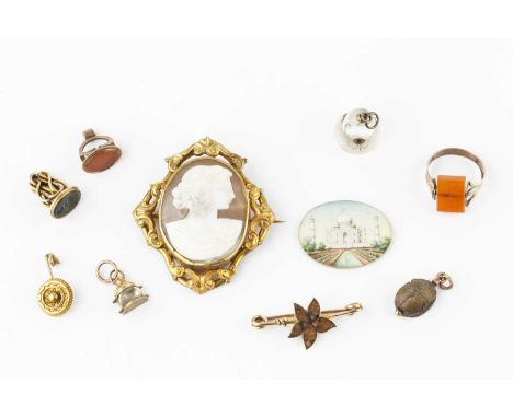 A collection of antique and later jewellery, comprising a Victorian oval shell cameo brooch, with openwork foliate scroll fra