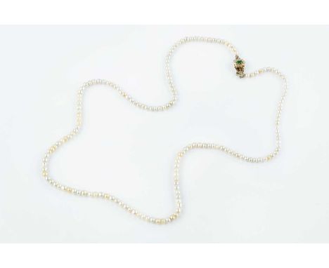 A pearl single strand necklace with diamond set clasp, the single strand of slightly graduated pearls to a navette-shaped cla