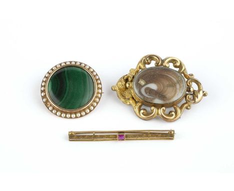 A collection of brooches, comprising a malachite and half pearl panel brooch, of circular design, (one half pearl deficient, 