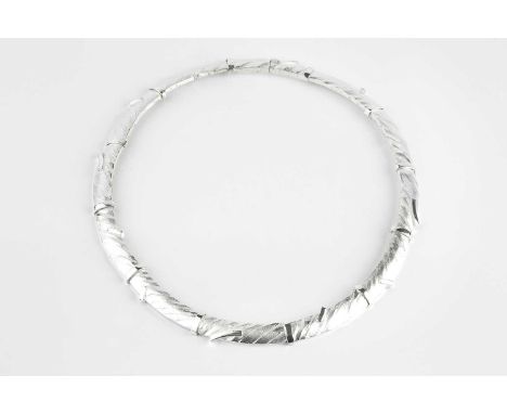 A silver collar necklace by Lapponia, designed as a series of shaped rectangular panels of textured abstract form and part-fr