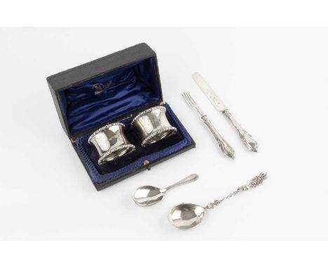 A pair of Edwardian silver napkin rings, by Atkin Bros, Sheffield 1904, in fitted case, a silver caddy spoon, a late Victoria