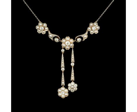A half pearl and diamond négligée pendant necklace, designed as a trio of half pearl flowerheads, each centred with a round b