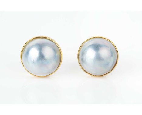 A pair of mabe pearl ear studs, each mabe pearl of bluish tint, in polished collet setting, on post and hinged clip fittings,