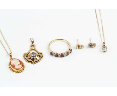 A collection of jewellery, comprising a ruby and diamond half hoop ring, a diamond and gem set pendant and ear studs suite, a