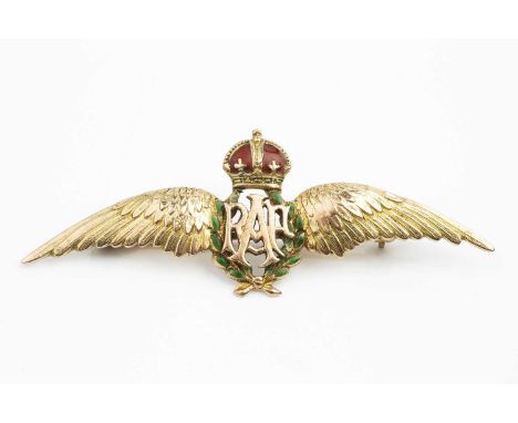 An enamel RAF wings brooch, with green enamel wreath and red enamel coronet, stamped '9ct', length 5.5cmCondition report: Sma