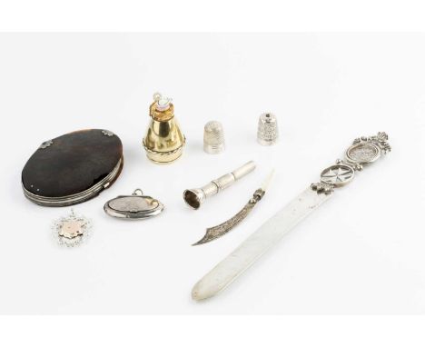 A small collection of items, comprising a 19th century tortoiseshell and white metal oval magnifying glass, 8.5cm, a late Vic