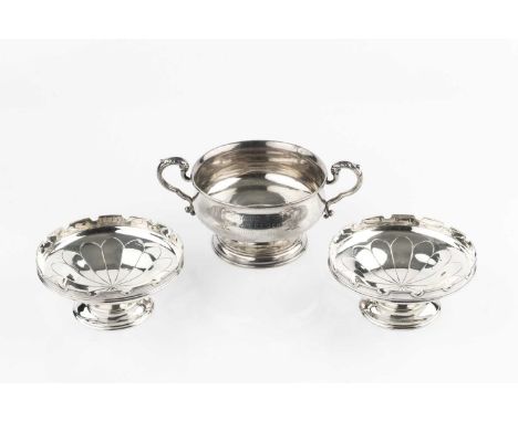 A pair of silver pedestal sweetmeat dishes, with crenellated borders, by Mappin &amp; Webb, Sheffield 1928, 11cm wide, and a 