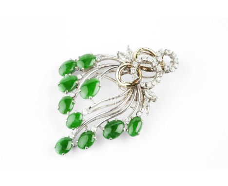 A jade and diamond spray brooch/pendant, designed as a tiered wirework spray of oval jade cabochons and circular-cut diamonds