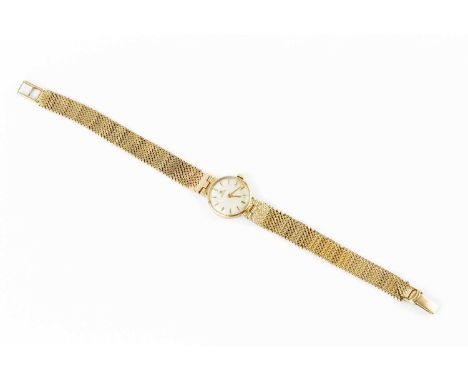A lady's bracelet watch by Omega, the circular silvered dial with gilt baton markers, to a calibre 620 jewelled manual wind m