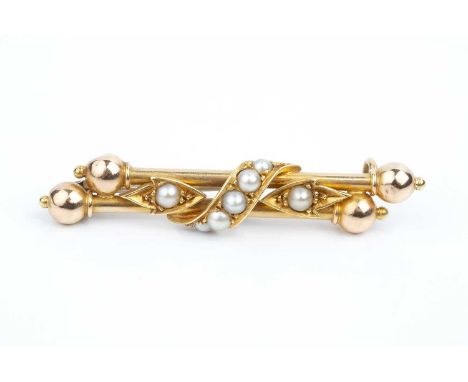 A late Victorian half pearl set brooch, designed as a double bar with bead terminals, centred with a half pearl set scroll an
