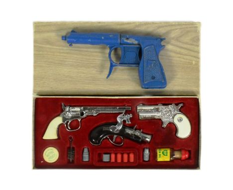 A vintage 1960s BCM Company (Derby) Outlaw Presentation Case of Miniature Antique Firearms. The set containing replica flintl