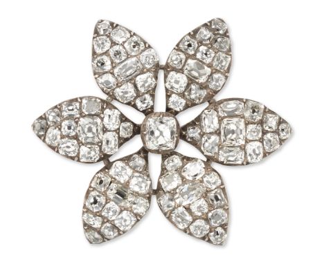 A George III diamond flowerhead brooch, with central cushion-shape diamond and six pavé old-mine-cut diamond cluster petals, 