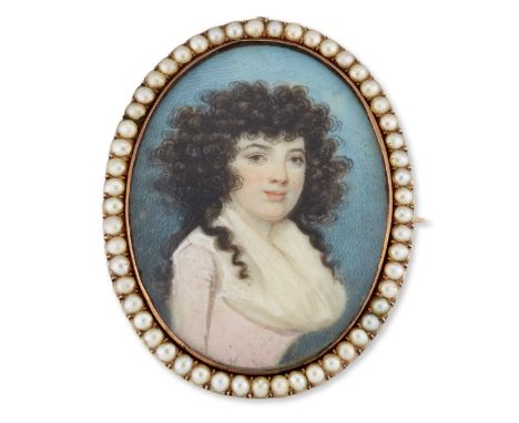 A late 18th century gold brooch mounted portrait miniature painted on ivory, the oval miniature painted to depict a young lad