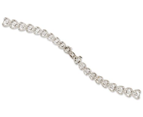 An Art Deco period diamond bracelet, formerly from a wristwatch, composed of series of diamond collet and wishbone shaped art