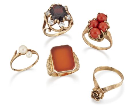 A group of five rings, comprising: a 9ct gold garnet and cubic zirconia cluster ring, London hallmarks, 1973, ring size L½; a