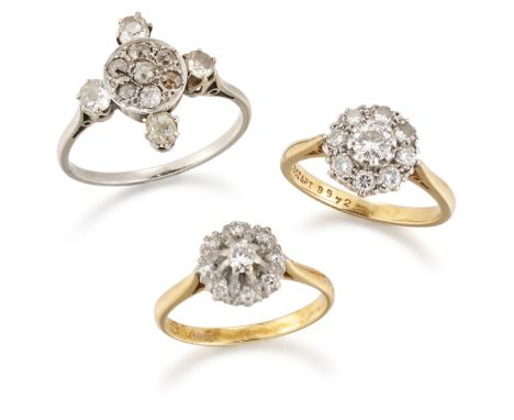 Three diamond rings, comprising two of brilliant-cut diamond circular-cluster design, ring sizes L½; and a pavé old-brilliant