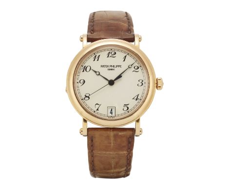 Patek Philippe. An 18ct gold automatic calendar wristwatch, Circa 2002Calatrava, Reference 5053J, Case number 4273969Automati